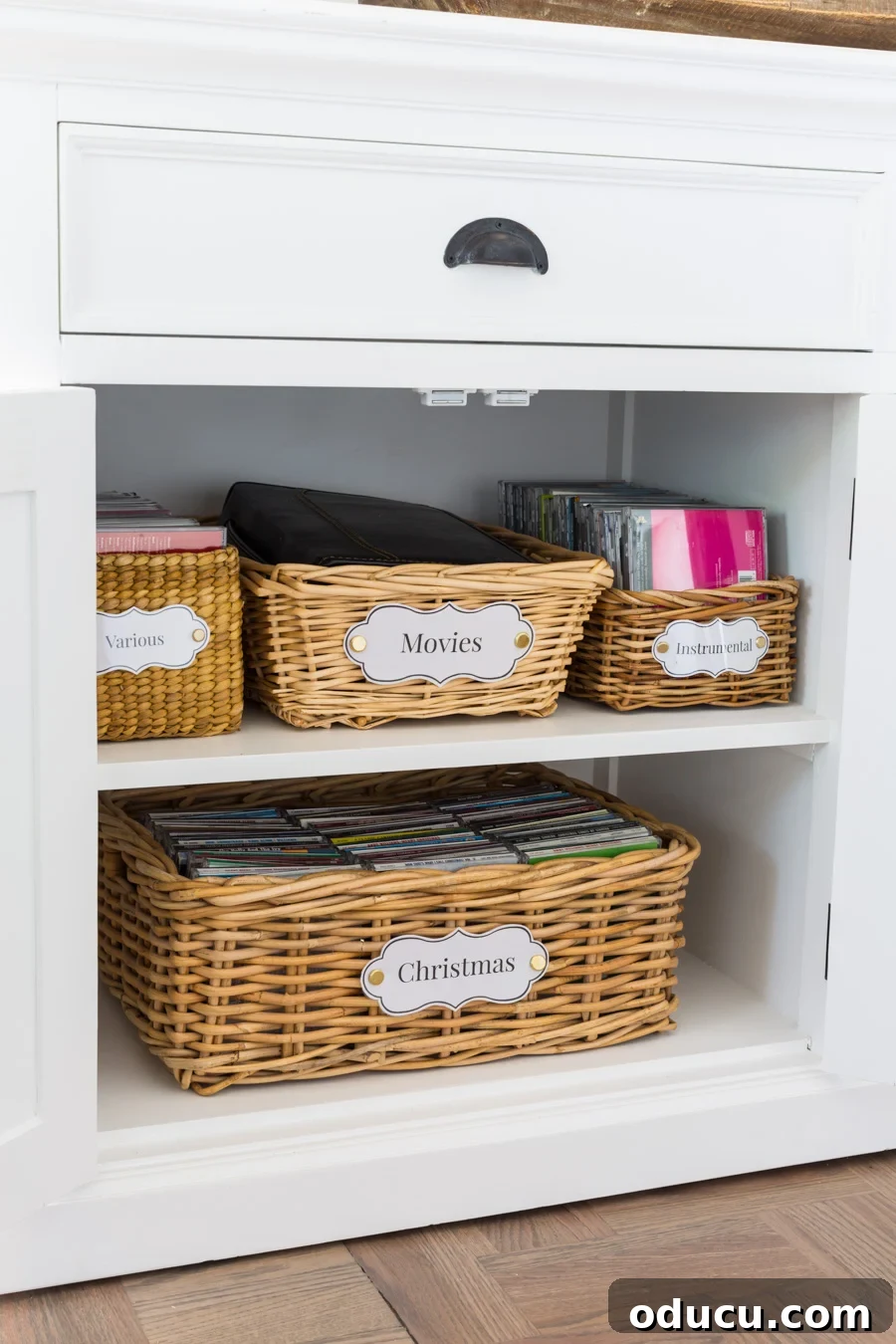 Chic Storage Without the Splurge 11 Transformed thrift store baskets with handles into stylish storage inside a cabinet.
