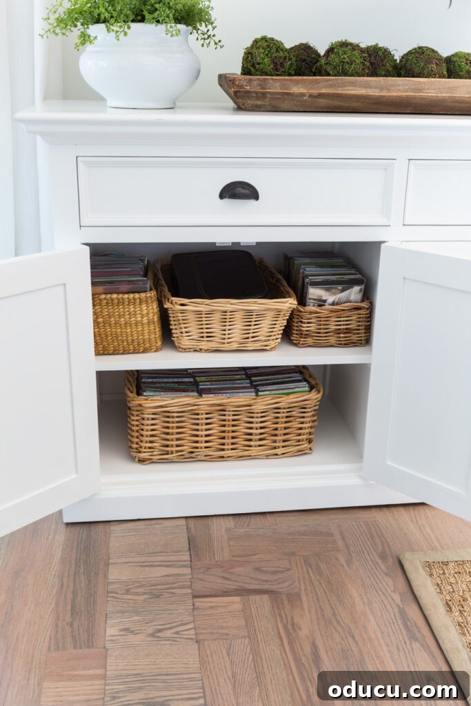 Chic Storage Without the Splurge 5 Storage baskets in a sideboard cabinet.