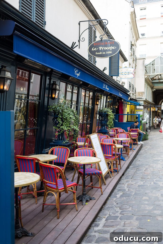 Le Procope Restaurant in Paris, prominently located on Rue de l'Ancienne Comedie, a historic culinary landmark known for its famous patrons.