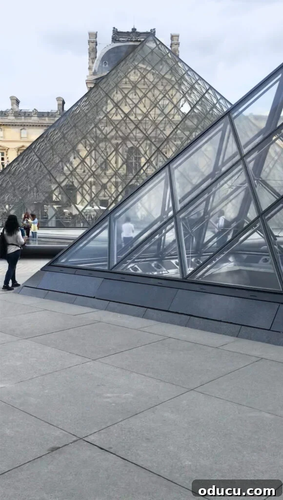 Paris bike tours provide a unique opportunity to see the iconic glass pyramids up close in the Louvre courtyard, contrasting modern design with historical architecture.