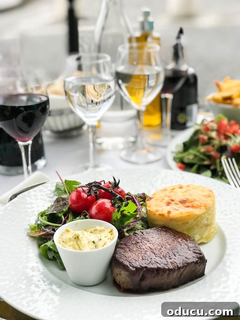 A delightful French dinner served at an inviting outdoor cafe in the heart of Paris, featuring classic dishes and wine.