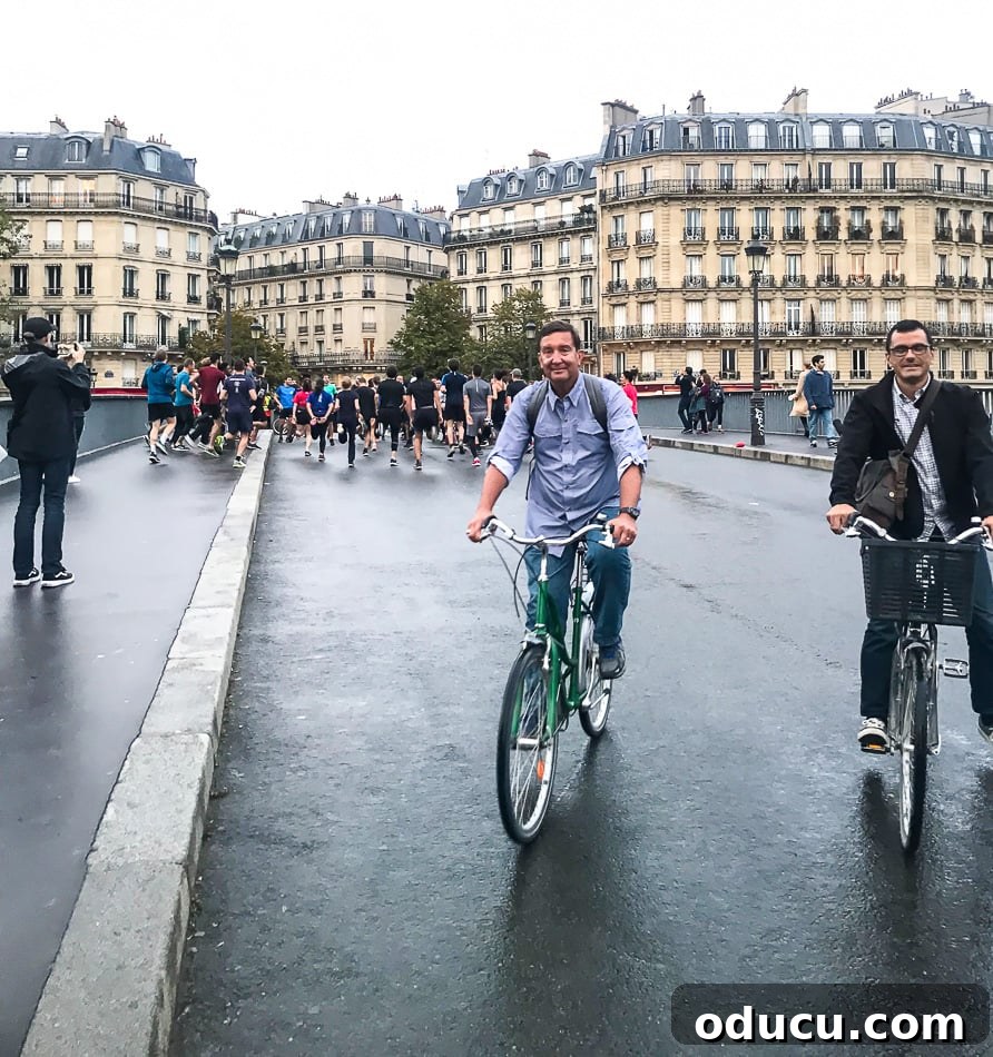 Enjoying a picturesque bike tour through Paris with Bike About Tours, experiencing the city's charm on two wheels under the evening sky.
