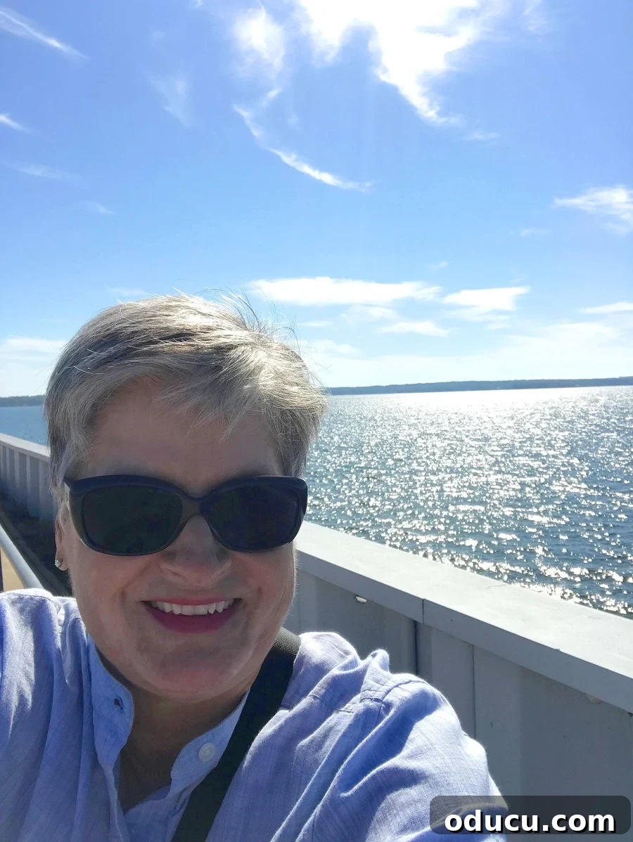 The Undeniable Magic of Living on Lake Murray in SC 25 Diane enjoying a walk on the scenic Lake Murray Dam walkway