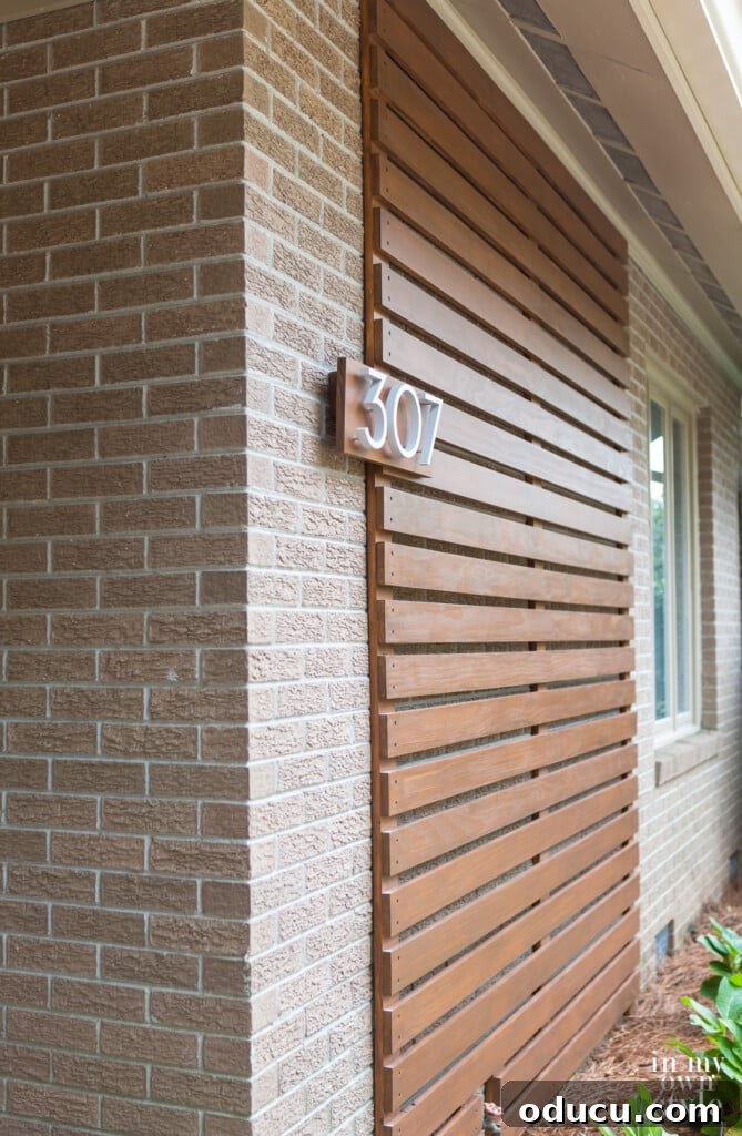 Install Modern Floating House Numbers for Instant Curb Appeal 11 Crisp, modern raised house address numbers elegantly displayed on a custom wood plaque, enhancing exterior design.