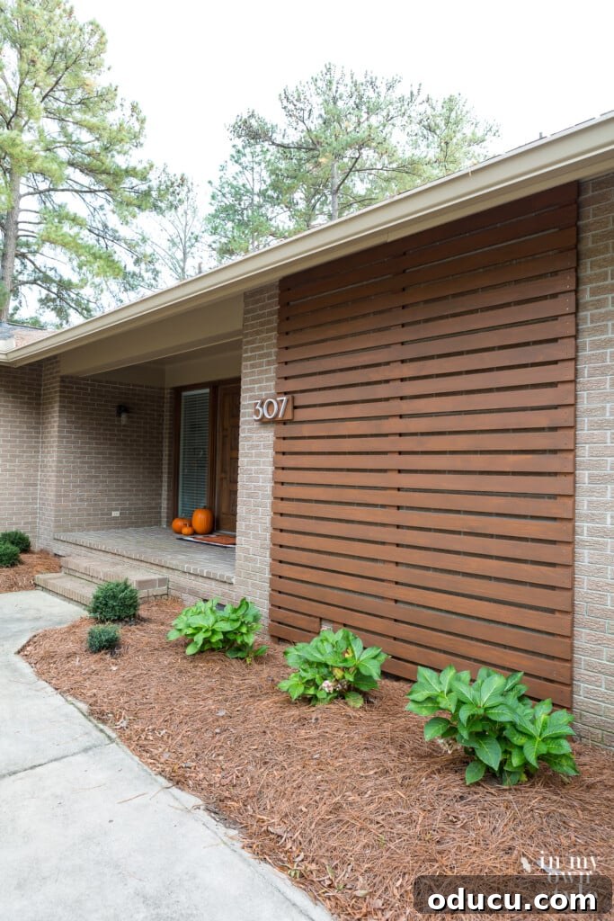 Install Modern Floating House Numbers for Instant Curb Appeal 4 Full exterior view of a house featuring Design Within Reach Neutra Modern House Numbers prominently displayed near the entry.