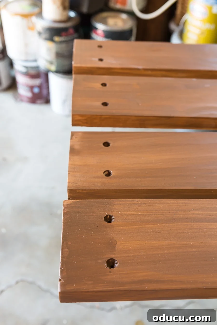How to drill screw holes in wood slats to create a wood slat wall outdoor, showing proper alignment.