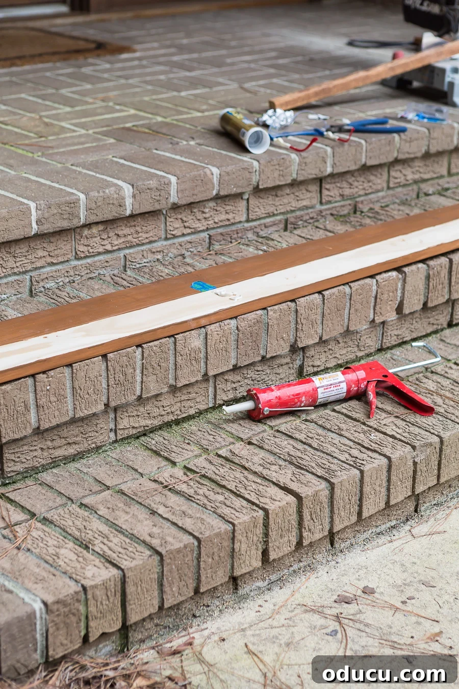 How to attach the wood to make a slat wall without using screws in the center, utilizing adhesive.