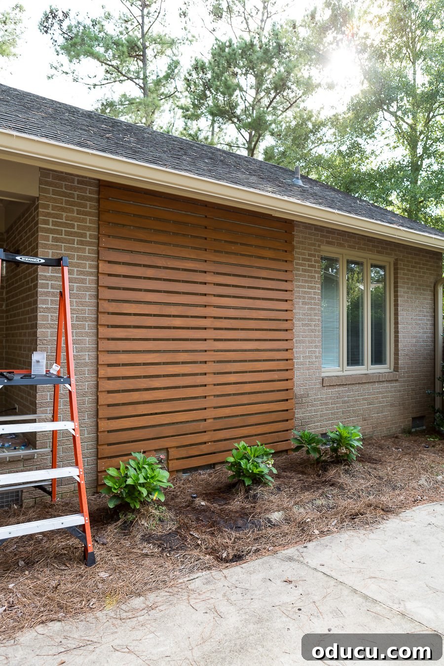 How to make a wood slat wall of the exterior of a house, showing the progression of horizontal boards.