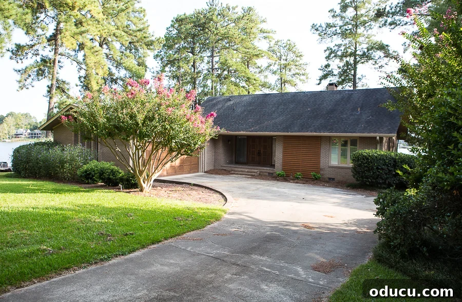 Ranch style house with horizontal wood slat wall as an exterior architectural feature, enhancing its modern curb appeal