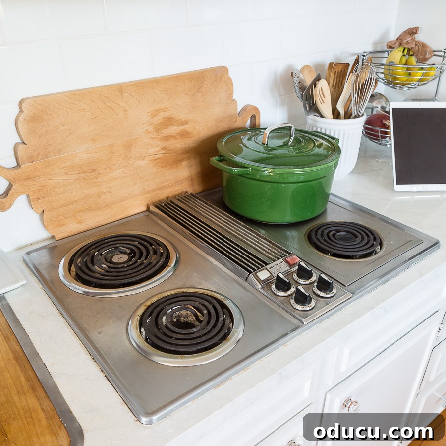 Flawless Finish: Repairing Painted Kitchen Counter Scratches and Dings 2 Vintage 1970 Jenn Air cooktop in white kitchen, showcasing the initial painted countertops.