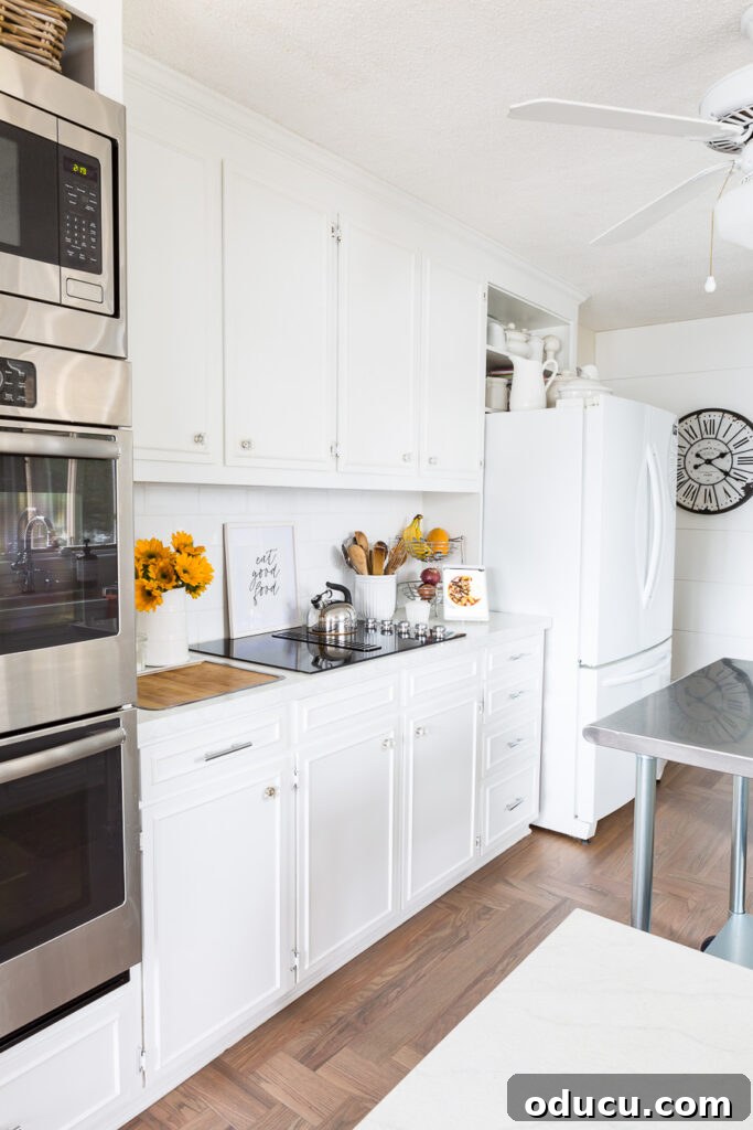 Flawless Finish: Repairing Painted Kitchen Counter Scratches and Dings 16 Picture of a bright white kitchen with beautifully painted kitchen countertops.