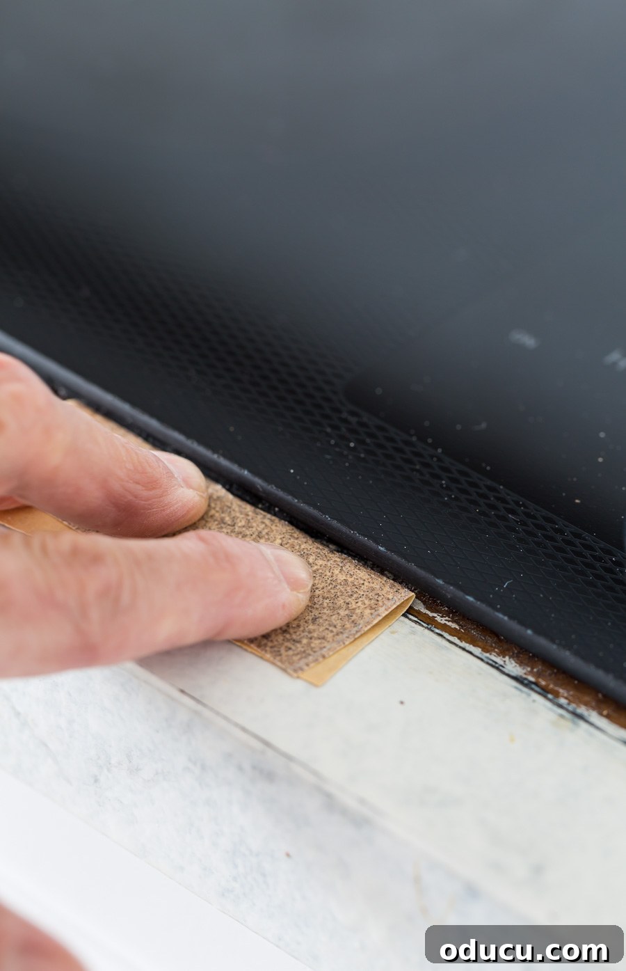 Flawless Finish: Repairing Painted Kitchen Counter Scratches and Dings 9 How to repair painted countertops. First step is sanding the damaged area.