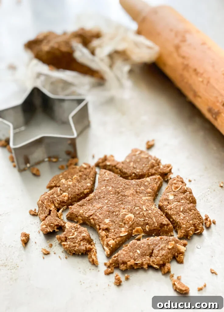 Rolled out dough cut out into a star shape with a cookie cutter, symbolizing festive baking preparations