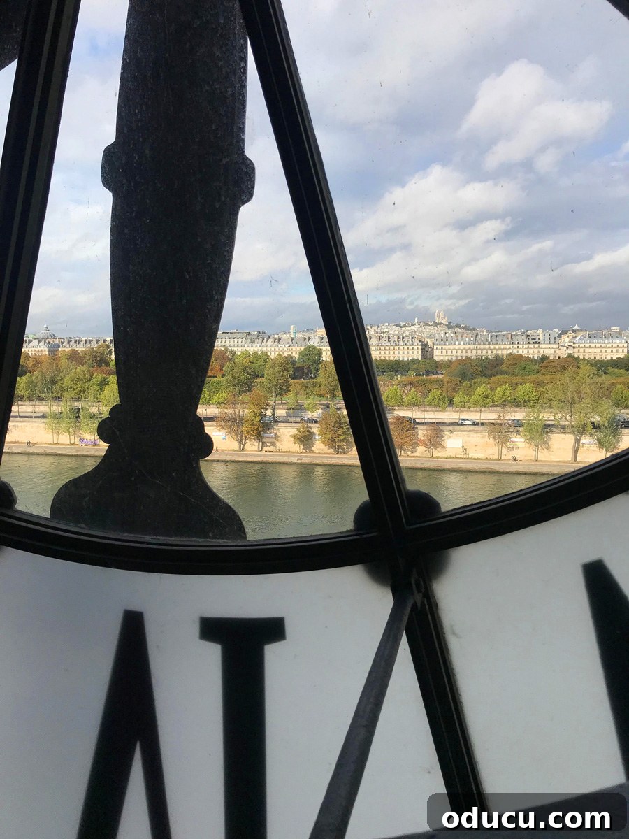 Discovering Paris on Foot 22 Looking through the large Roman numeral clock at the Museum D'Orsay in Paris.