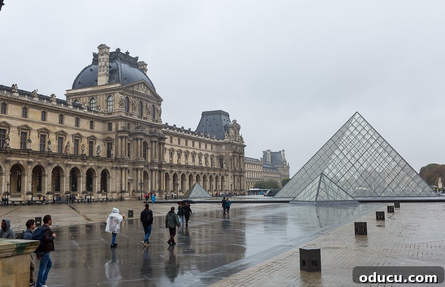 Discovering Paris on Foot 9 the Louvre Pyramid on a rainy day