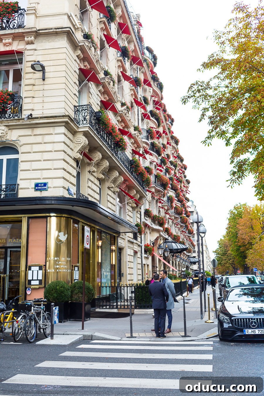 Discovering Paris on Foot 10 Paris apartment building with red awnings.