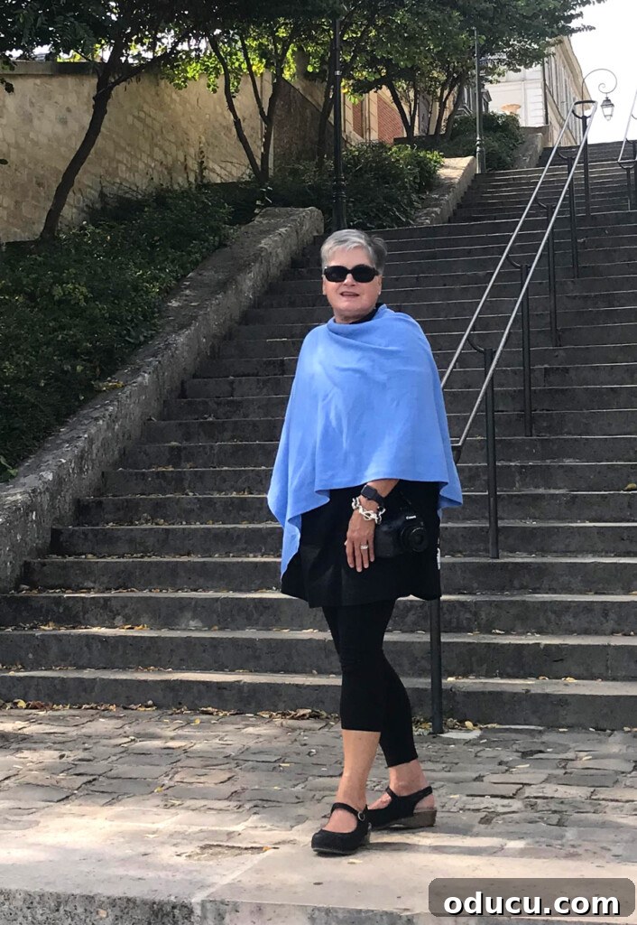 Ascending Paris's Masterpiece 8 A traveler enthusiastically walking up and down a series of steps in a picturesque part of Paris, France.