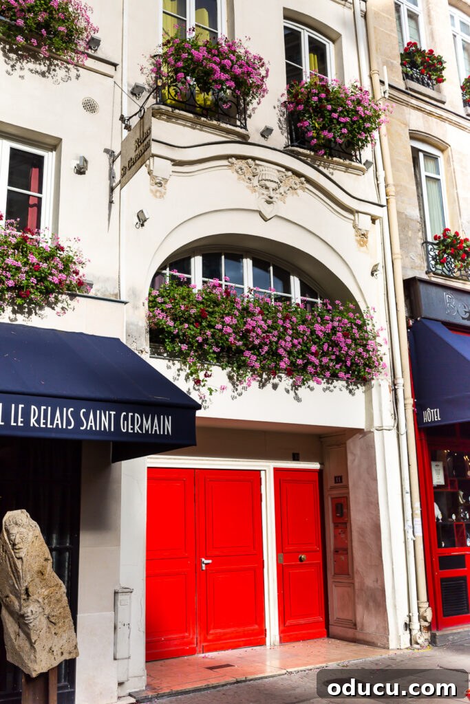 Ascending Paris's Masterpiece 9 Charming flower boxes overflowing with colorful plants, adding beauty to a Parisian streetscape.