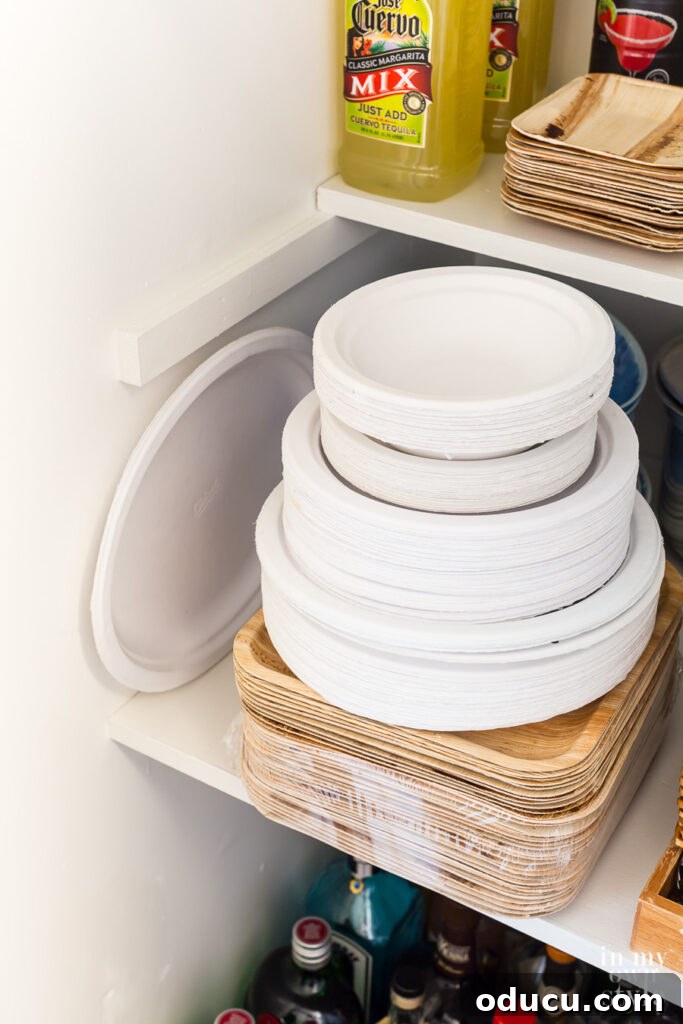 Why Primer Is Essential For Painting Over Stained Paint 13 White paper plates stacked neatly in an entertaining supply closet, matching the fresh white walls.