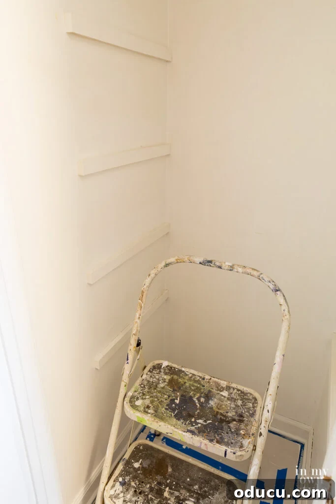 Why Primer Is Essential For Painting Over Stained Paint 7 Interior walls in a closet with one coat of KILZ 2 primer applied, showing stain blocking.