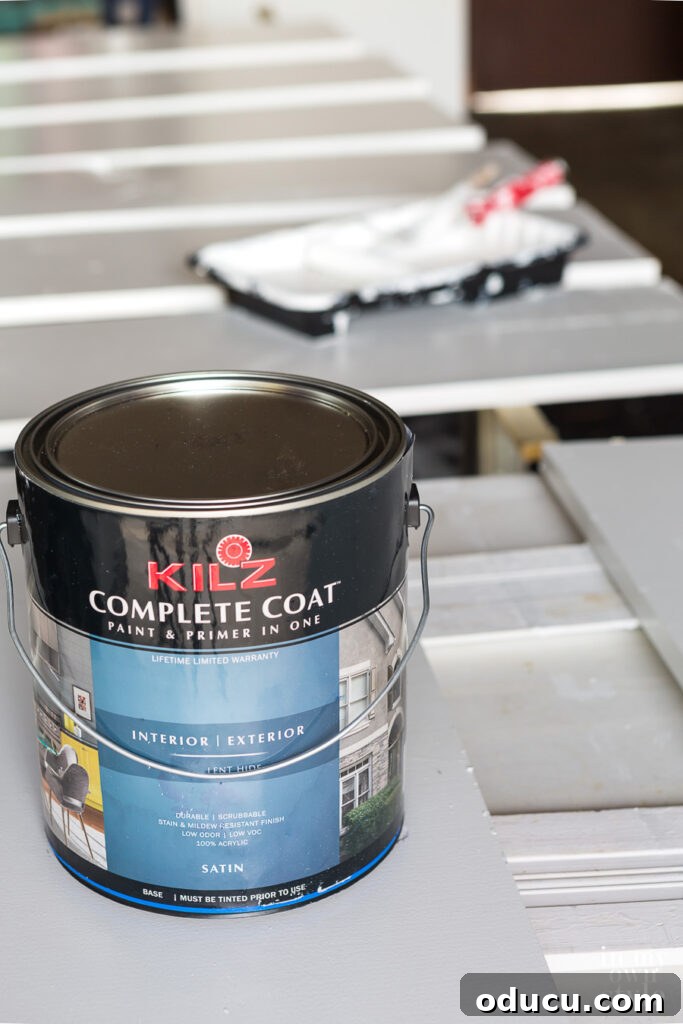 Why Primer Is Essential For Painting Over Stained Paint 8 KILZ Complete Coat in White being used over KILZ 2 primer on walls and wood shelves in a small closet.