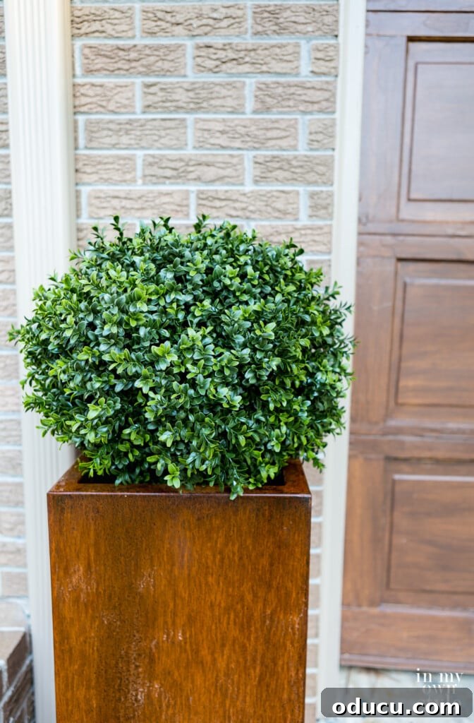 Unlock Corten's Rustic Beauty Instantly 6 Fake boxwood globe in Veradek Corten steel planter, showcasing the achieved rusted finish.