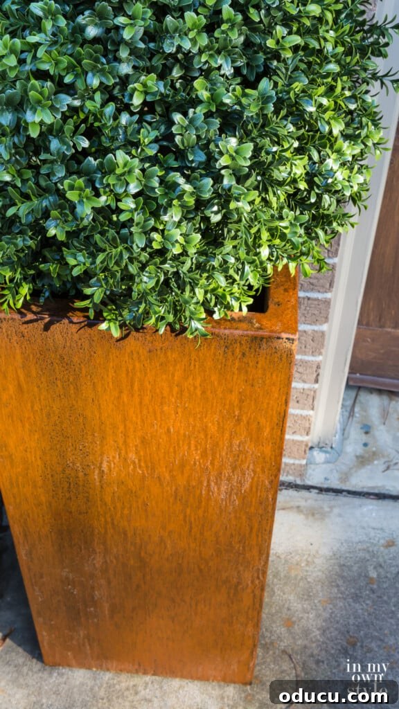 Unlock Corten's Rustic Beauty Instantly 10 Veradek Corten steel planter receiving an accelerating rust treatment, showing the progression of the patina.