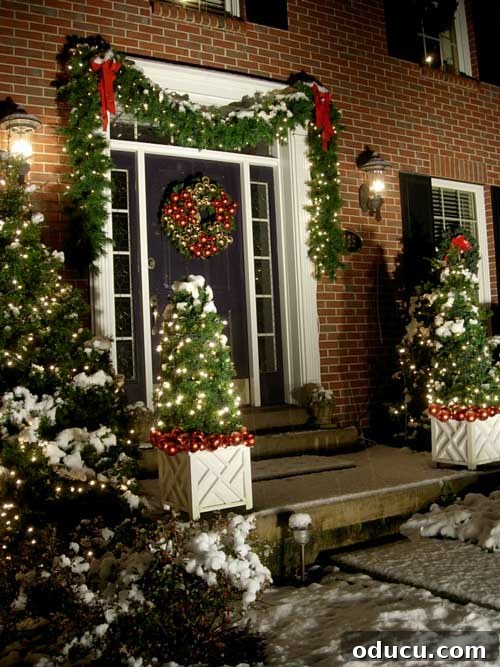 DIY Christmas Garland and other Holiday Decorating Ideas #christmasgarland #garland #holidaydecoratingideas #outdoorchristmaslighting #outdoorchristmasgarland #diychristmasgarland #christmasgarlandideas Snow-covered home beautifully decorated with Christmas lights, wreaths, and lush garlands draped over windows and doors, showcasing festive outdoor holiday decor.