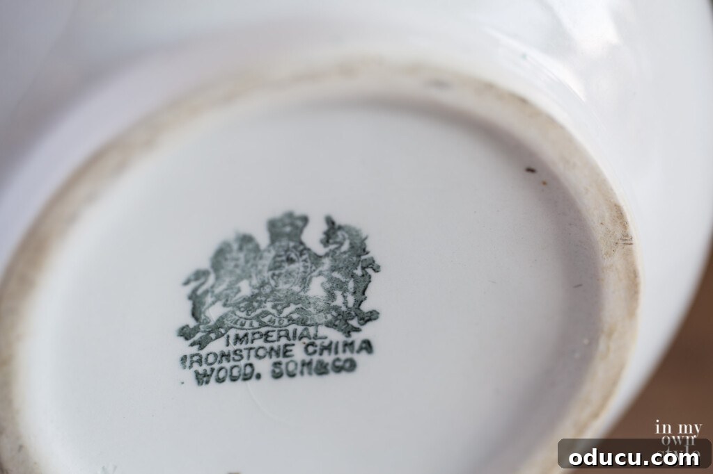 Decorating Magic for Just $23 10 Close-up of the distinctive Ironstone marking on the bottom of a white pitcher, confirming its authenticity.
