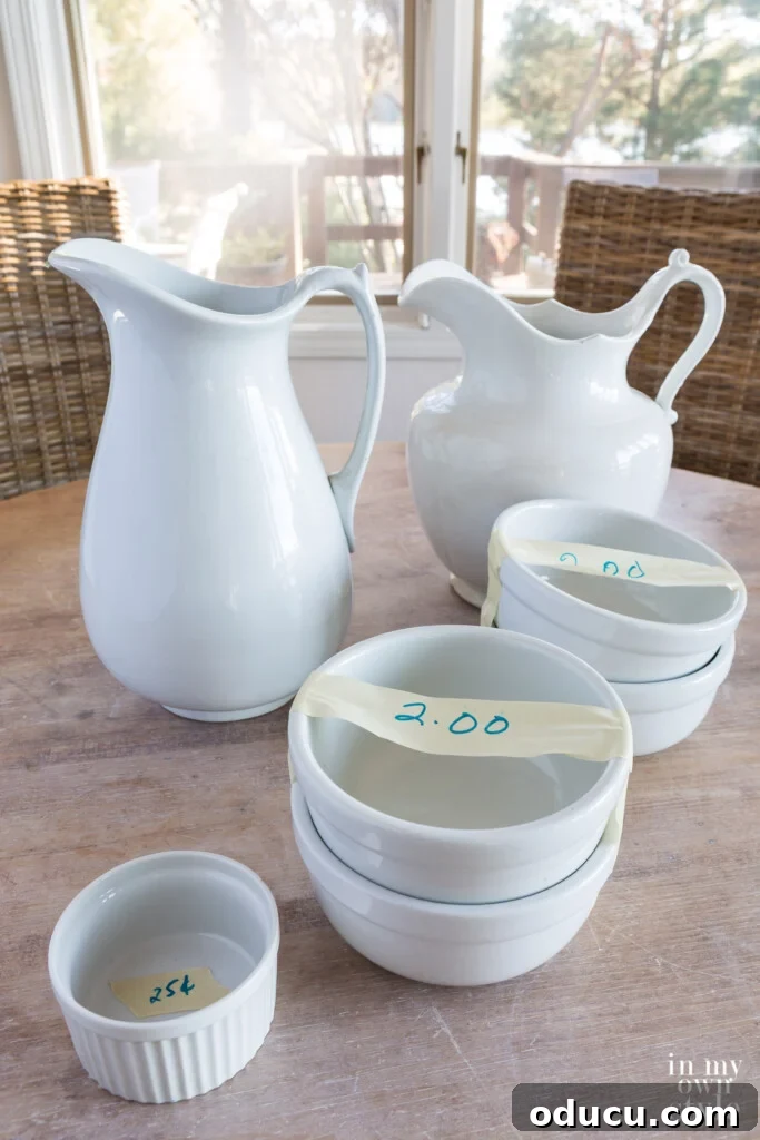 Decorating Magic for Just $23 9 Beautiful white Ironstone pitchers, acquired for a mere $3 at a church trash and treasure sale.