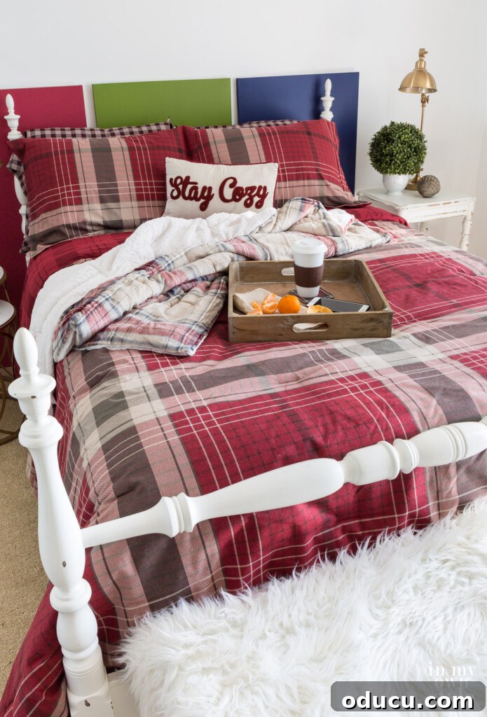 Spare Room to Serene Sanctuary 7 CuddlDuds Red plaid comforter and shams on a bed, illustrating a cozy and stylish guest bed.