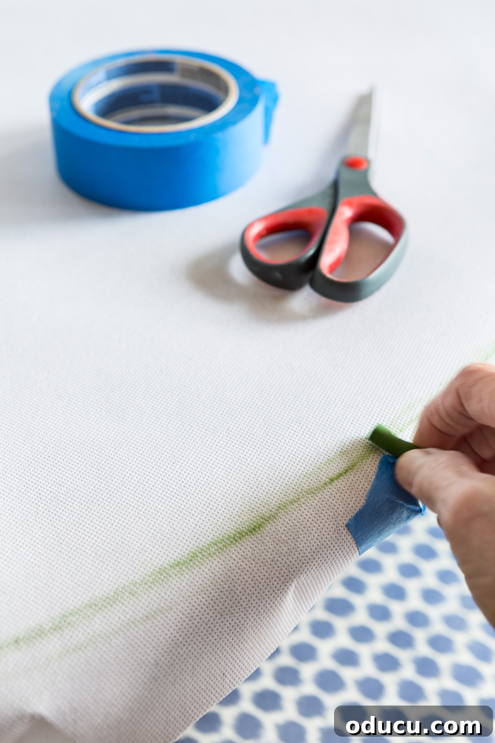 How to make a pattern to cut when creating a paper table cloth cover using bulletin board roll paper, demonstrating the crayon marking technique for precision.