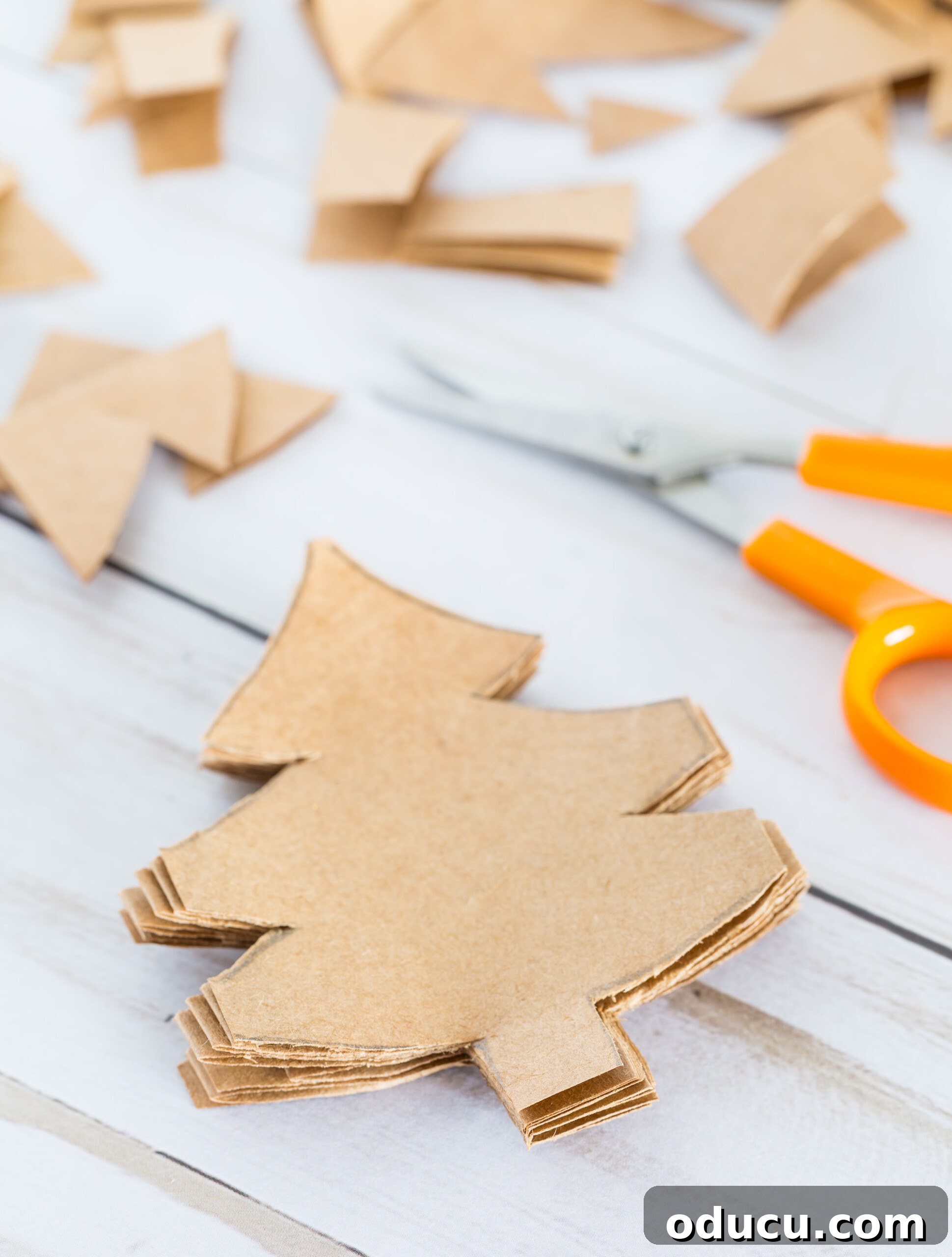 Craft Your Own Christmas Tree Paper Chain 12 How to make a Christmas tree cut-out paper chain.