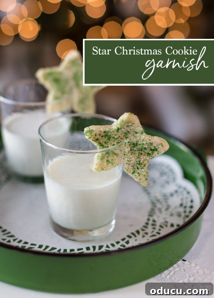 Dazzling Christmas Cookie Decorating Tricks 2 Two star shaped Christmas cookies on rims of glasses filled with milk, suggesting a unique serving idea for holiday parties.
