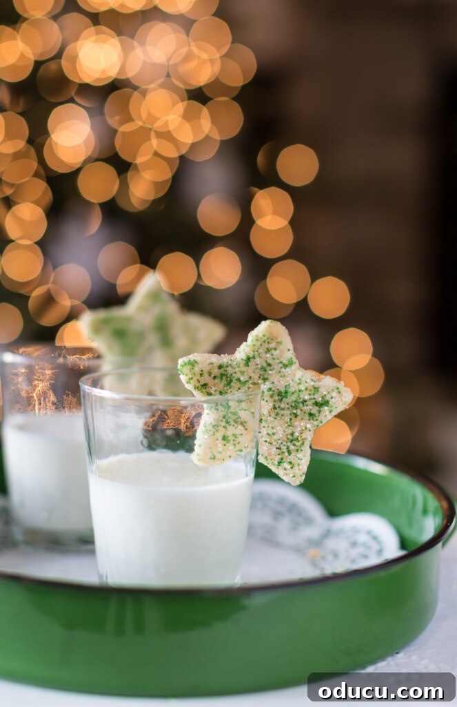 Dazzling Christmas Cookie Decorating Tricks 6 An inviting display of cookies for Santa, featuring star-shaped cookies on glasses of milk, ready for Christmas Eve.