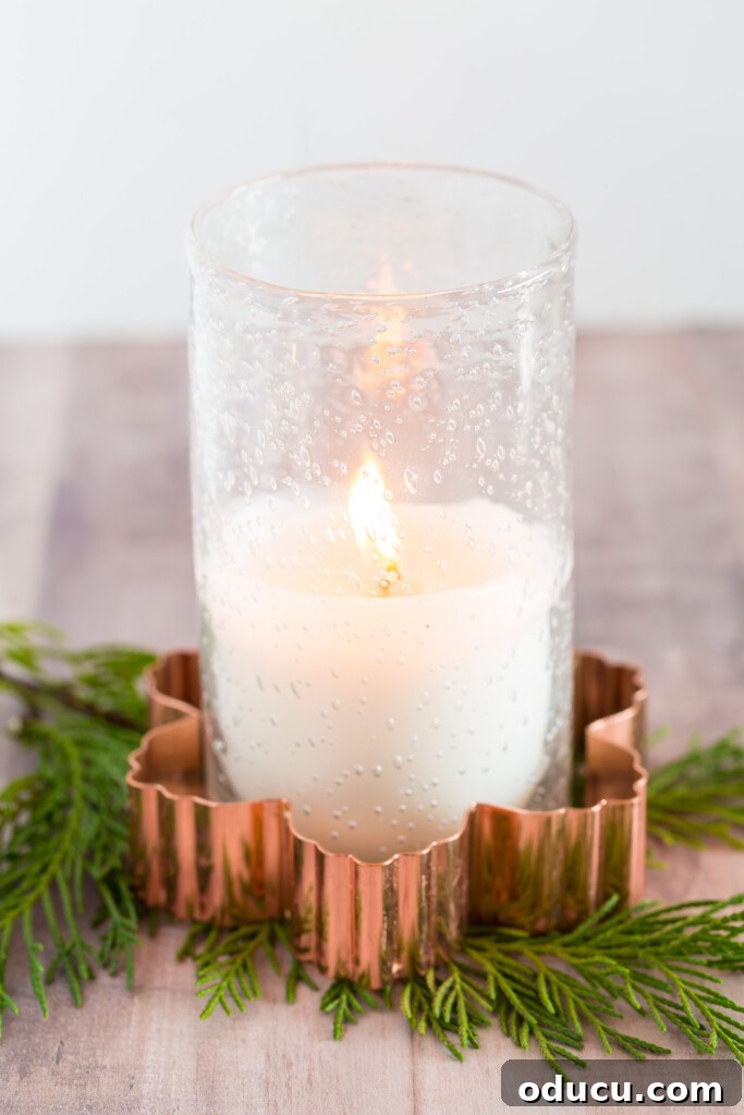 Quick Christmas Home Decor Hacks When Time is Tight 13 A glass candle and holder placed inside a copper cookie cutter makes for fast and easy Christmas decor