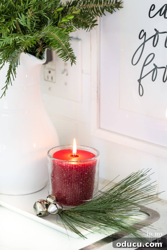 Quick Christmas Home Decor Hacks When Time is Tight 20 red Christmas candle in kitchen
