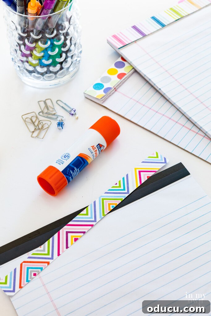 Smart Desk Organization Hacks 11 Custom-made desk accessories including legal pads decorated with patterned scrapbook paper