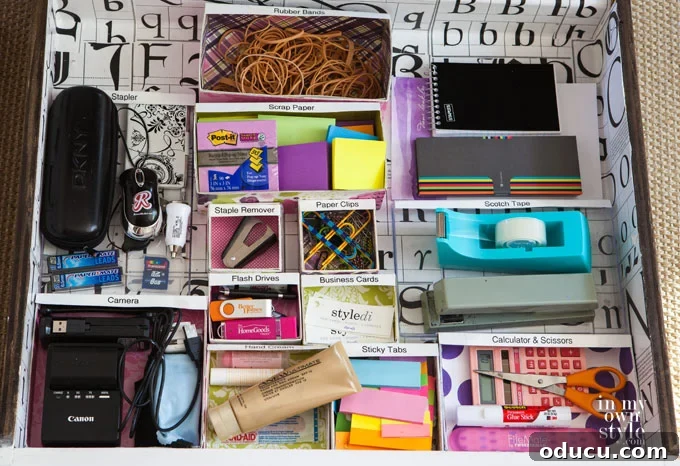 Smart Desk Organization Hacks 6 Desk drawer organized with small, custom-decorated cardboard boxes as dividers