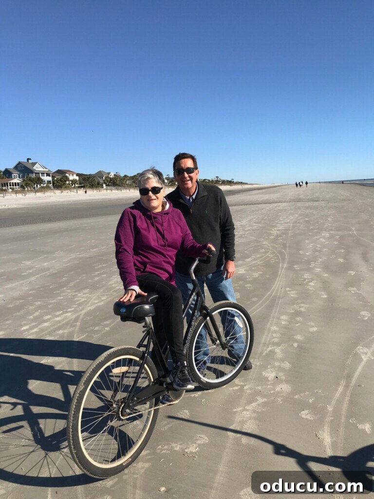 HGTV Dream Home 2020 Revealed 2 Two people riding bikes on the serene, empty beach at Hilton Head Island, SC, embodying the relaxed coastal lifestyle