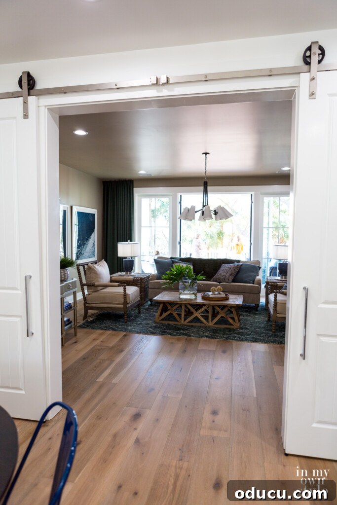 HGTV Dream Home 2020 Revealed 20 Rolling doors elegantly open to reveal the inviting media room on the second floor of the HGTV Dream Home