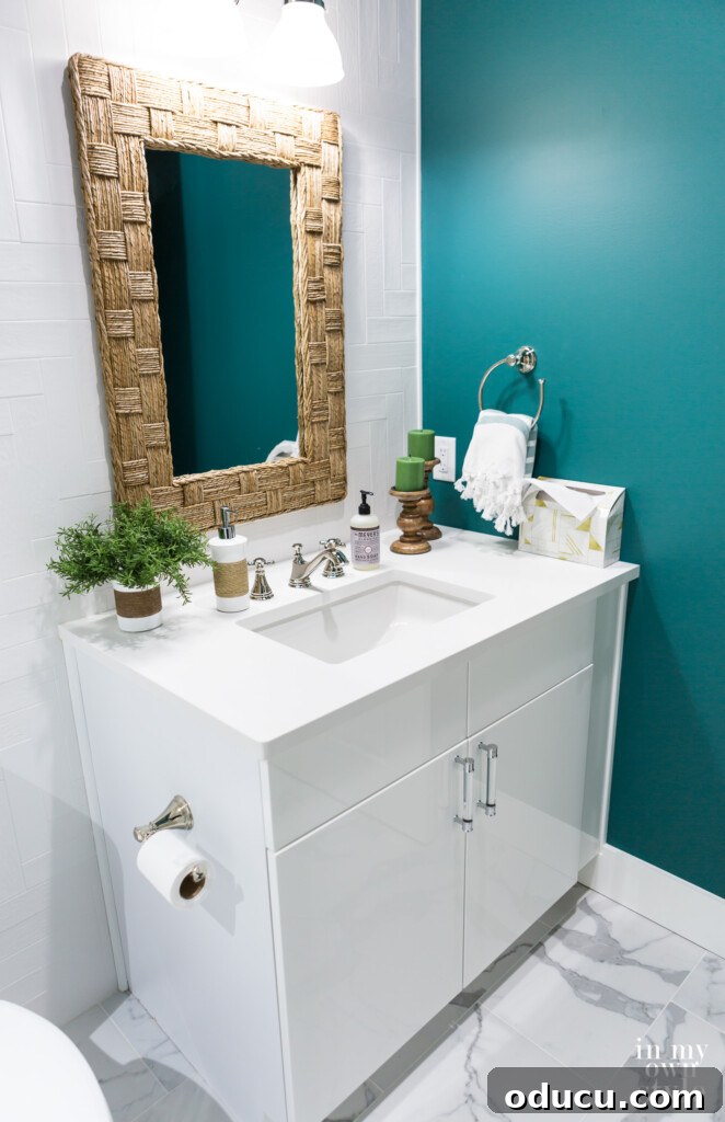 HGTV Dream Home 2020 Revealed 22 The elegantly designed second-floor hall bath at the HGTV Dream Home, featuring sleek Metro White cabinets and a teal and white color scheme