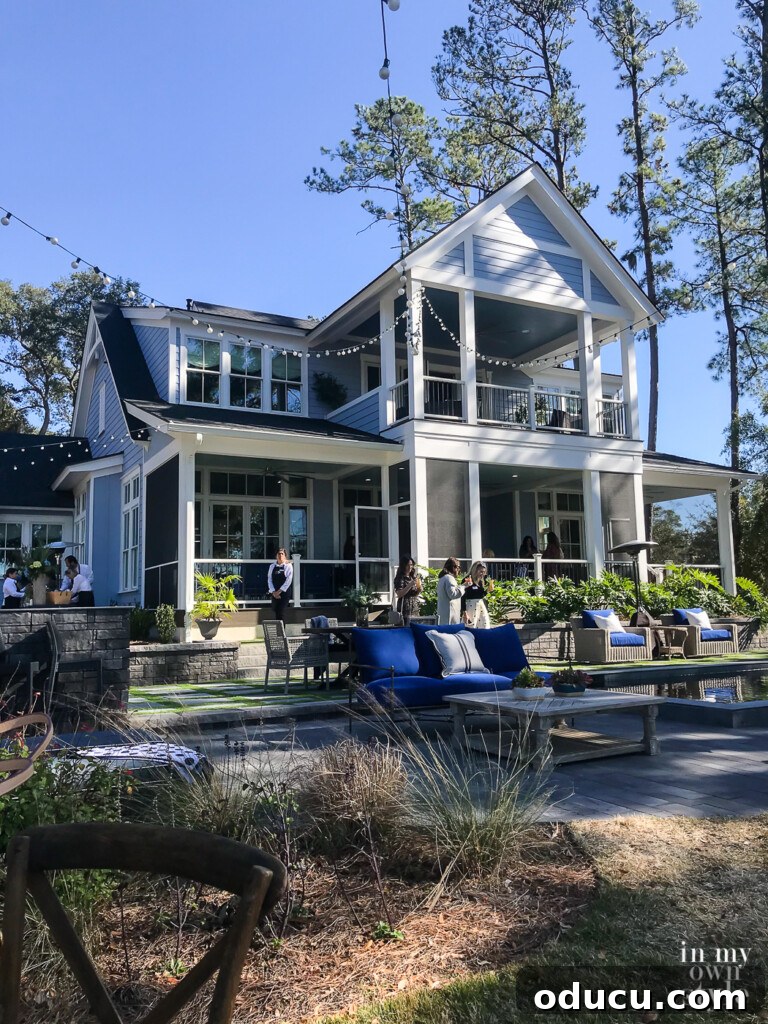 HGTV Dream Home 2020 Revealed 24 The impressive back view of the HGTV Dream Home, highlighting its expansive screened porches on both floors and lush natural surroundings