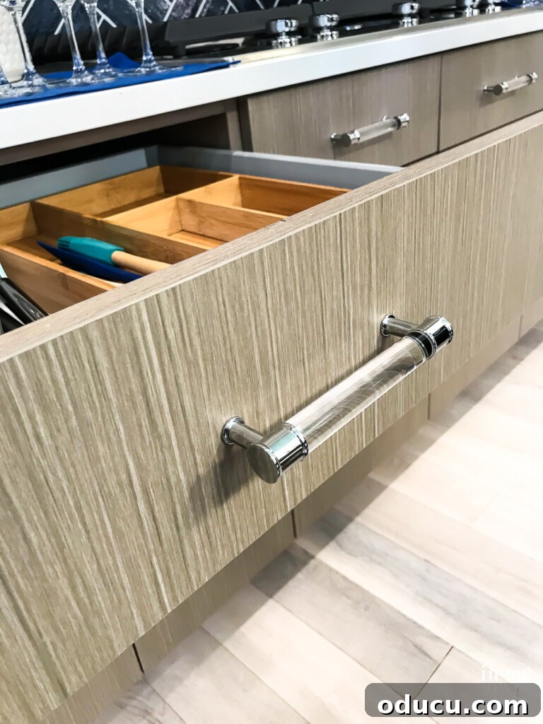 HGTV Dream Home 2020 Revealed 9 A close-up shot of the Cabinets to Go Charleston Driftwood cabinets, highlighting their warm grey tones and natural graining, perfect for a modern coastal kitchen