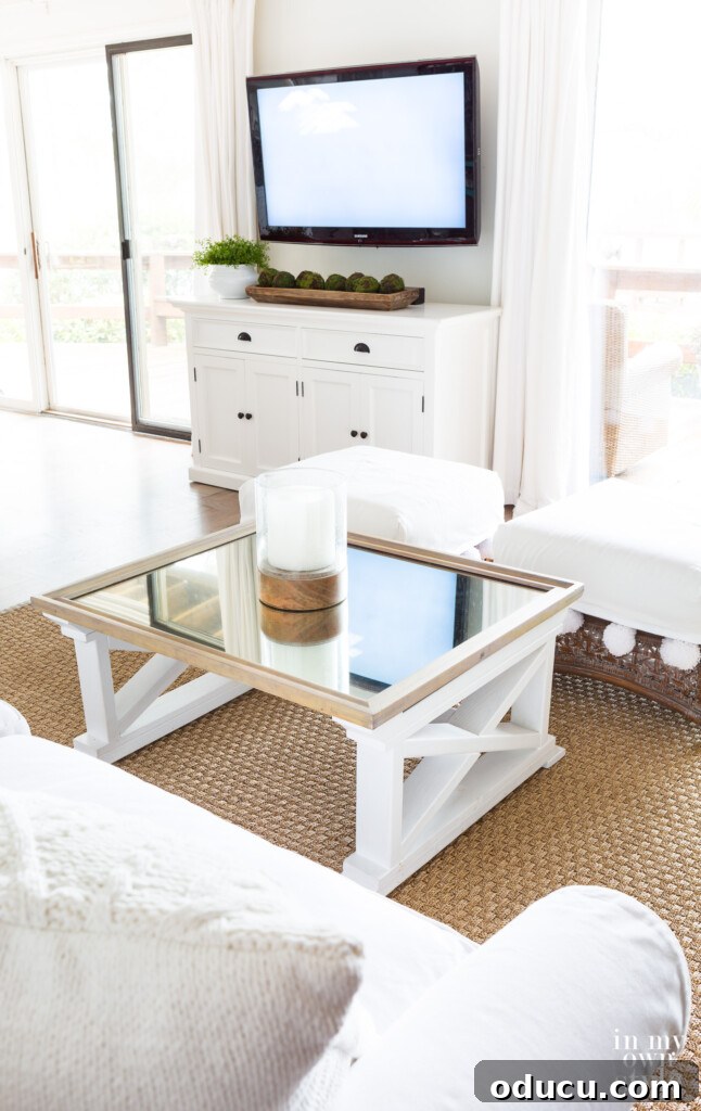 White and Wood Living Room Aesthetic 3 A room in transition between holiday decor to winter decor, showcasing a neutral base awaiting a seasonal refresh.