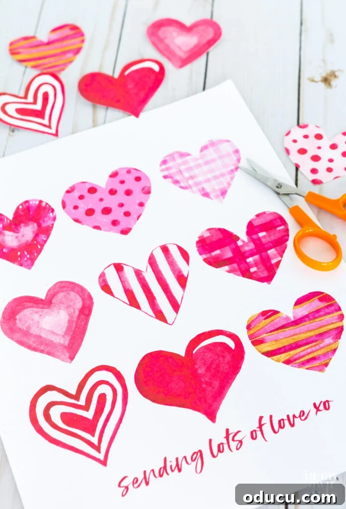 Free printable sheet of watercolor hearts to use for Valentine cards and crafts.