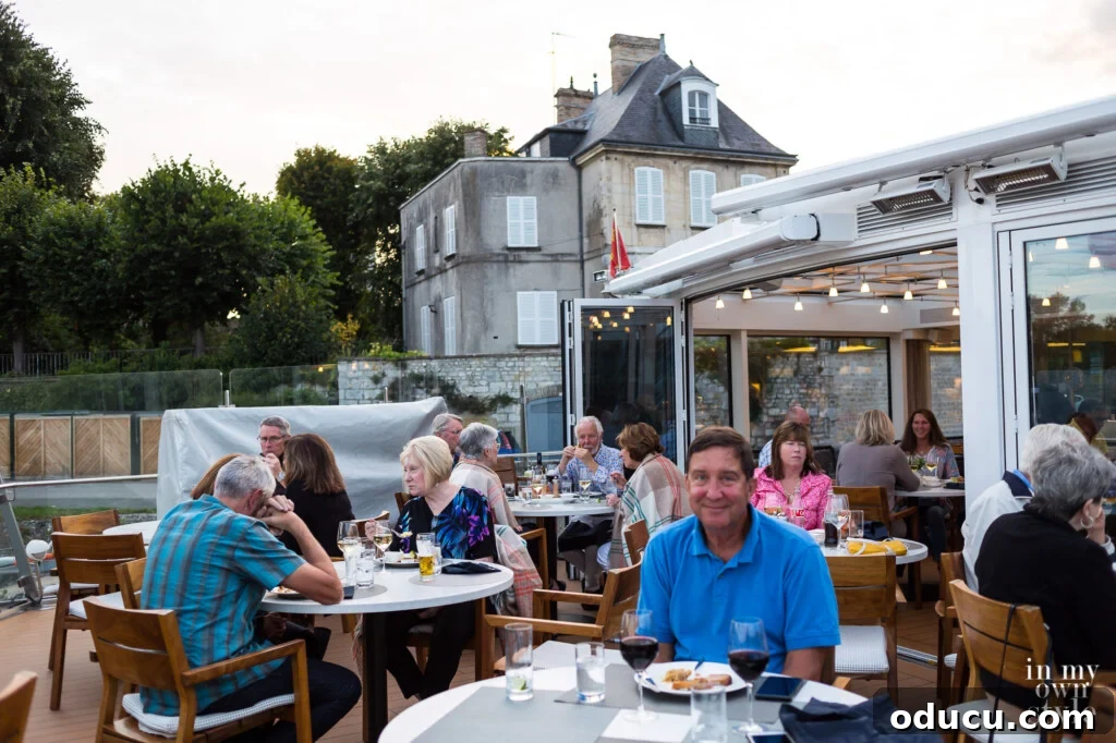 An Iconic Viking Journey Along the Seine 14 Outdoor dining area on the bow of the Viking River Cruise Longship Kadlin, offering scenic views.