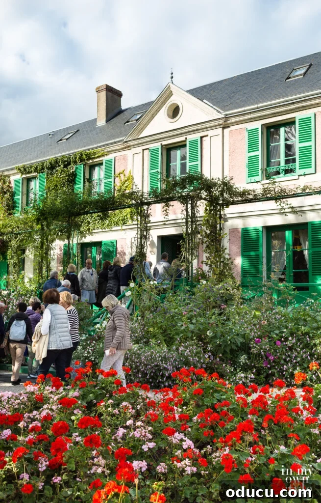 An Iconic Viking Journey Along the Seine 27 Claude Monet's house in Giverny, France, surrounded by its vibrant gardens.