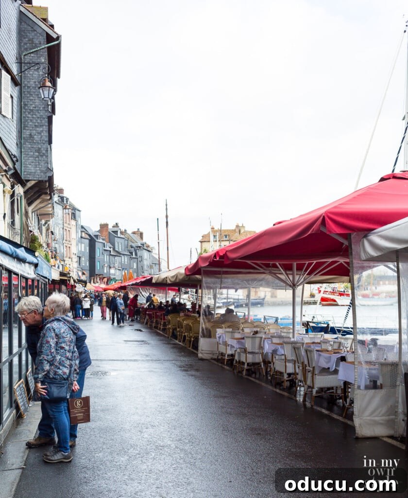 Seine Serenity A Viking River Cruise Through France 12 Outdoor cafes in the rain in Honfleur on the coast of Normandy