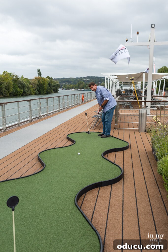Seine Serenity A Viking River Cruise Through France 64 Ed putting on the Viking River cruise ship putting green.